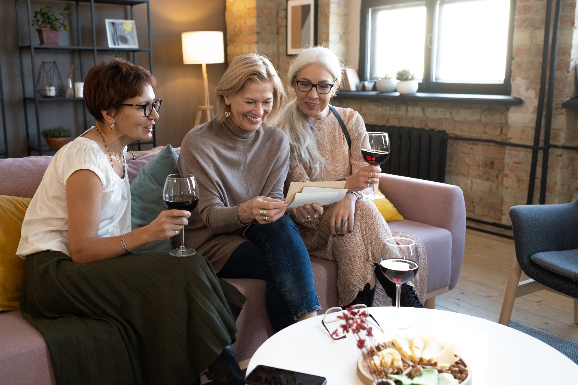 Women reading a letter from their friend